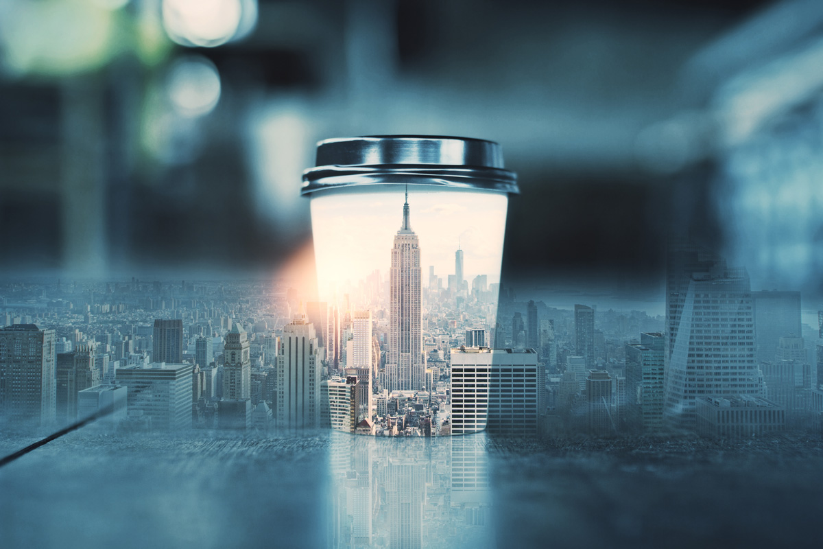 Coffee cup with abstract New York city skyline. Morning concept. Double exposure