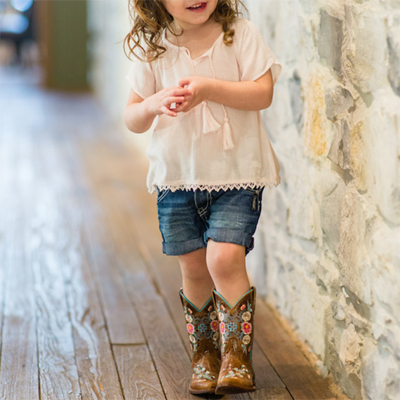 little girl in cowboy boots