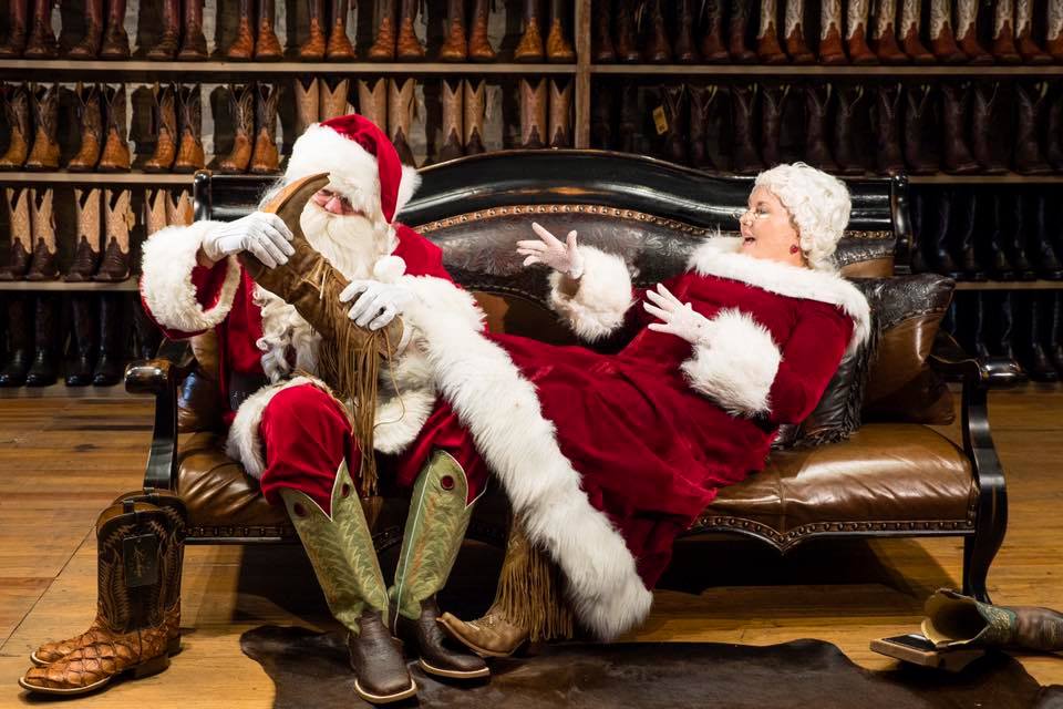 Cowboy Santa & Mrs. Claus trying on boots at Harry’s Boots